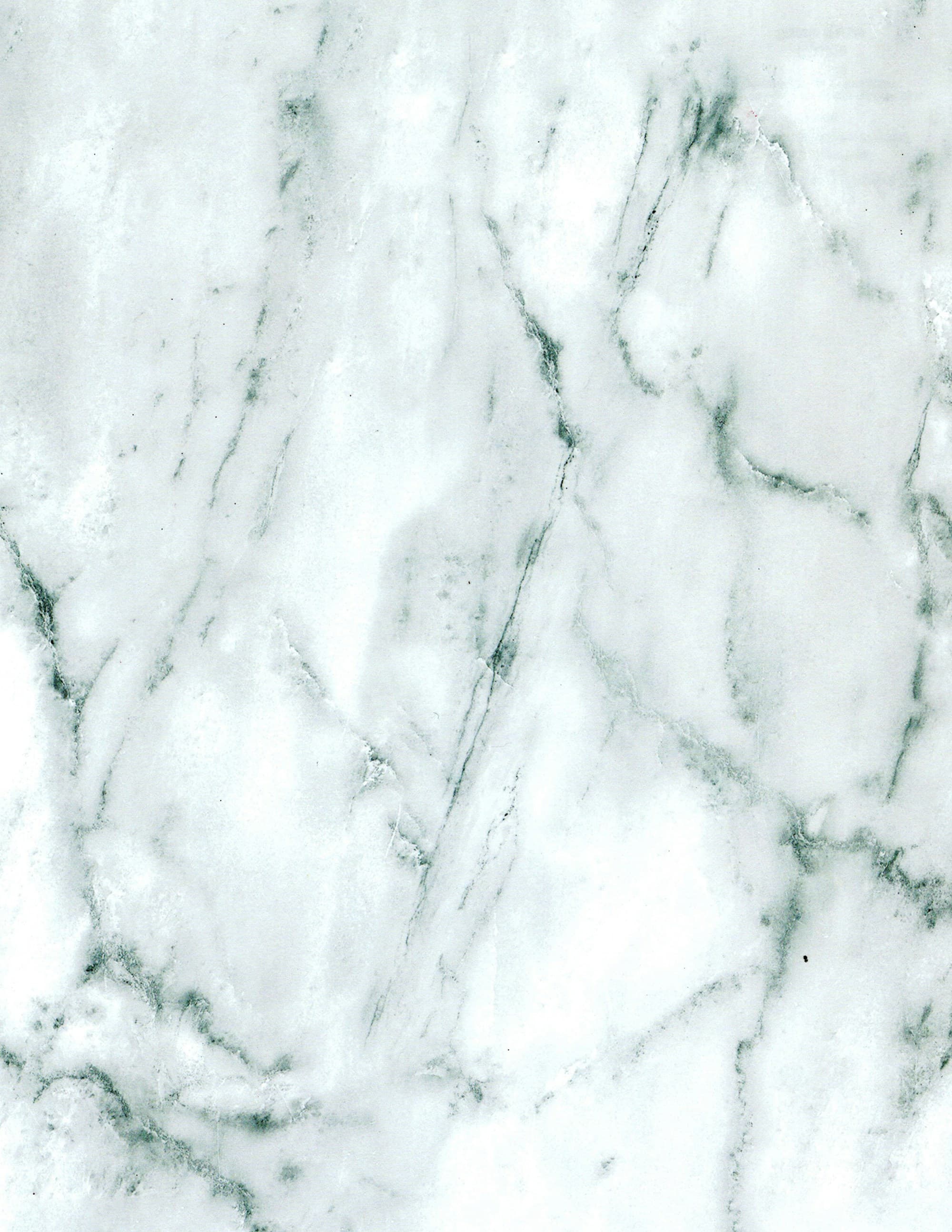 Close detail of a white marble surface showing fine grey veining